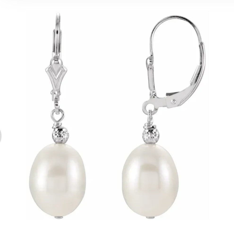 white Pearl drop earrings with silver hooks on a white background